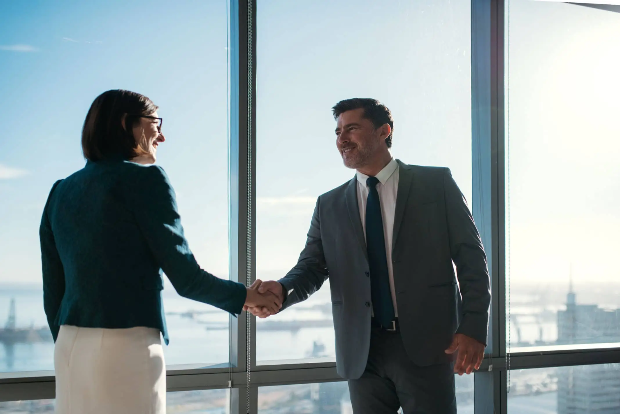 Man shaking hands with women